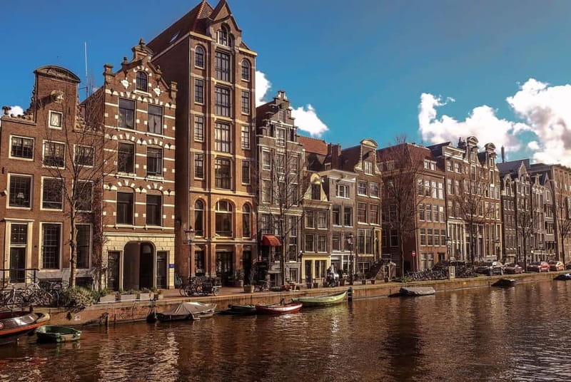 Amsterdam canal cruise with culinary burger or cheese & wine - On Board Comfort: Heated cabin, toilet, and stories in English