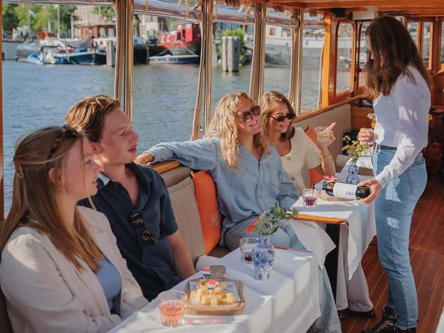 Amsterdam: Classic Saloon Boat Cruise with Cheese & Wine - Entering the Golden Age Canals, Without the Usual Tour Hustle