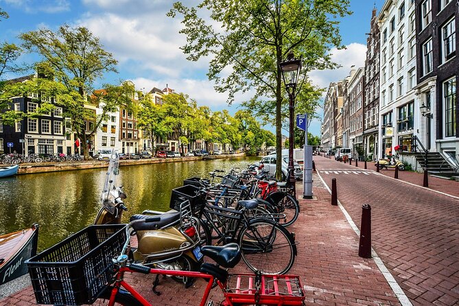 Amsterdam Day Trip from Brussels With Cheese, Clogs and Windmills - Windmills and the Amstel River: scenic photos without the detour