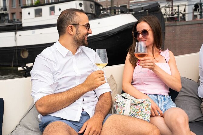 Amsterdam: Evening Candle Light Cruise With Wine & Cheese - Weather-proof cruising: covered boat, blankets, and the no-music rule