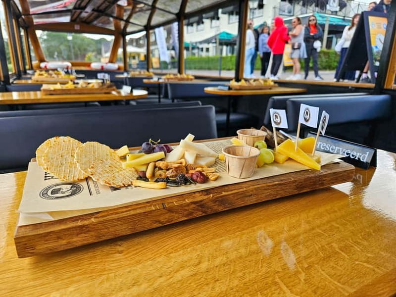 Amsterdam: Live GuideD Giethoorn Boat Tour & Cheese Platter - Getting From Amsterdam to Giethoorn: The Coach Ride That Sets the Pace