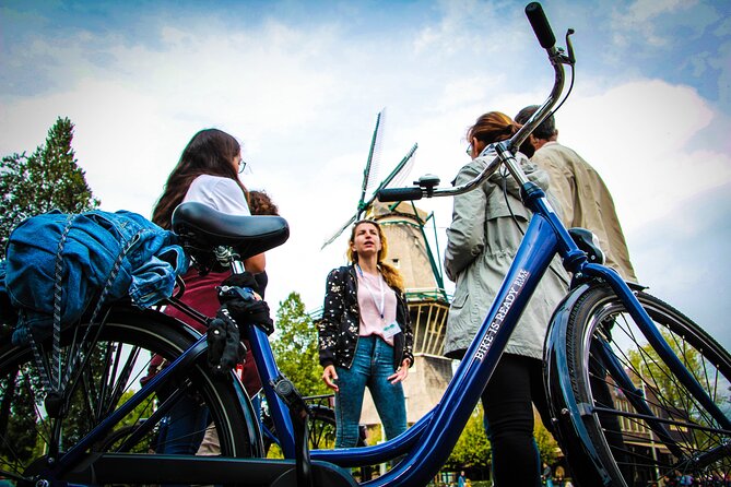 Amsterdam Small-Group Bike Tour With Canal Cruise, Drinks, Cheese - Amsterdam Centraal and De Gooyer Windmill: the classic intro sights