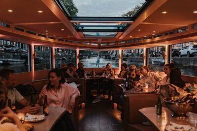 Amsterdam Small-Group Evening Canal Cruise Including Wine, Craft Beer, Cheese - The lighting strategy: why nighttime canal cruising feels different
