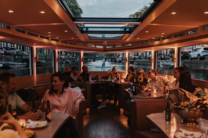 Amsterdam Small-Group Evening Canal Cruise Including Wine, Craft Beer, Cheese - The lighting strategy: why nighttime canal cruising feels different