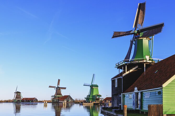 Amsterdam: Windmills, Cheese and Volendam Tour with Video Guide - Zaanse Schans: Windmills, Bridges, and Clog Craft