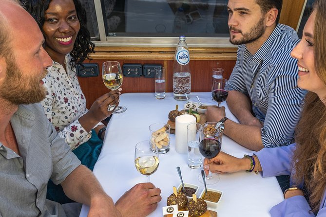 Amsterdam Wine and Cheese Evening Cruise - Route Highlights: Central Station, Maritime Sights, Skinny Bridge, and Reguliersgracht
