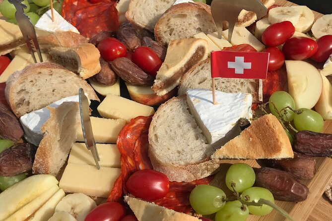 Cheese platter by Boat on Lake Thun, Interlaken - Your Main Event: The Cheese Platter (Hard + Soft, the Swiss Way)