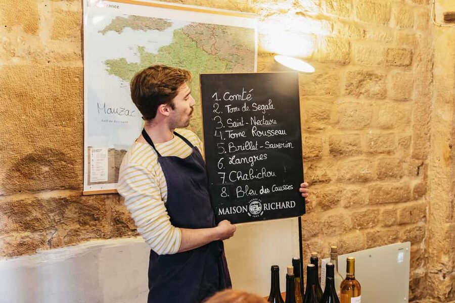 Cheese & Wine Tasting in Montmartre with Local Cheesemonger - The room setup: stone walls, relaxed pace, and real comfort