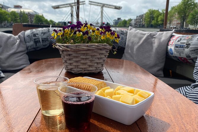 Dutch Cheese & Drinks Guided Amsterdam Boat Tour, All Inclusive - Meeting at Oudezijds Voorburgwal: starting in old Amsterdam fast